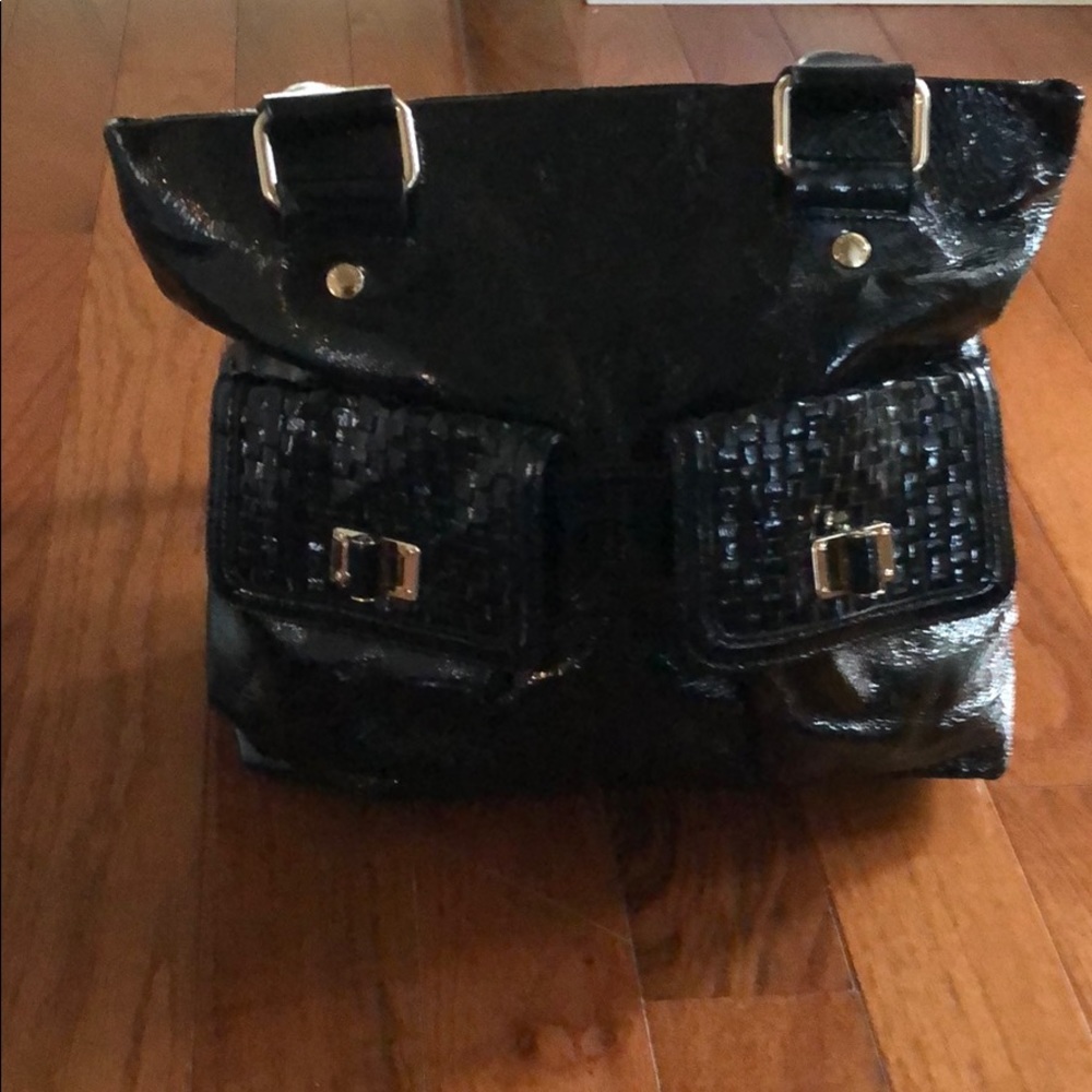 Elliott Lucca black patten leather handbag.